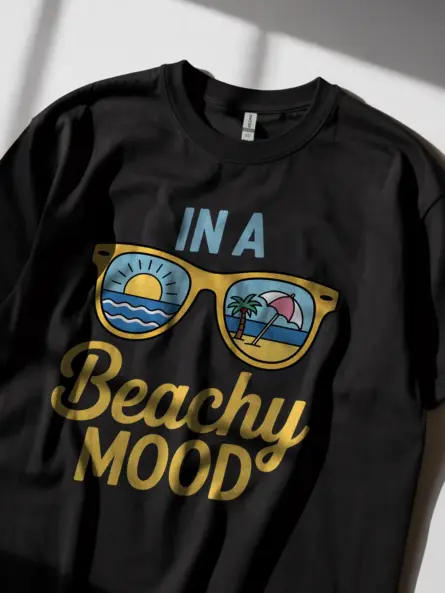 Black lifestyle image of beachy mood t-shirt – beach scene shirt with palm trees and sun