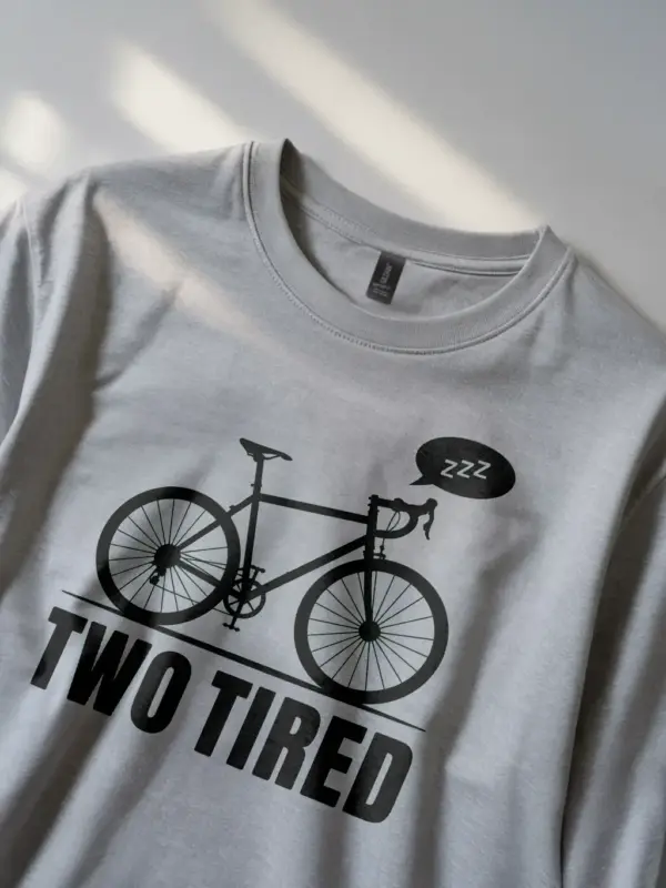 grey lifestyle image two tired funny cycling pun t-shirt