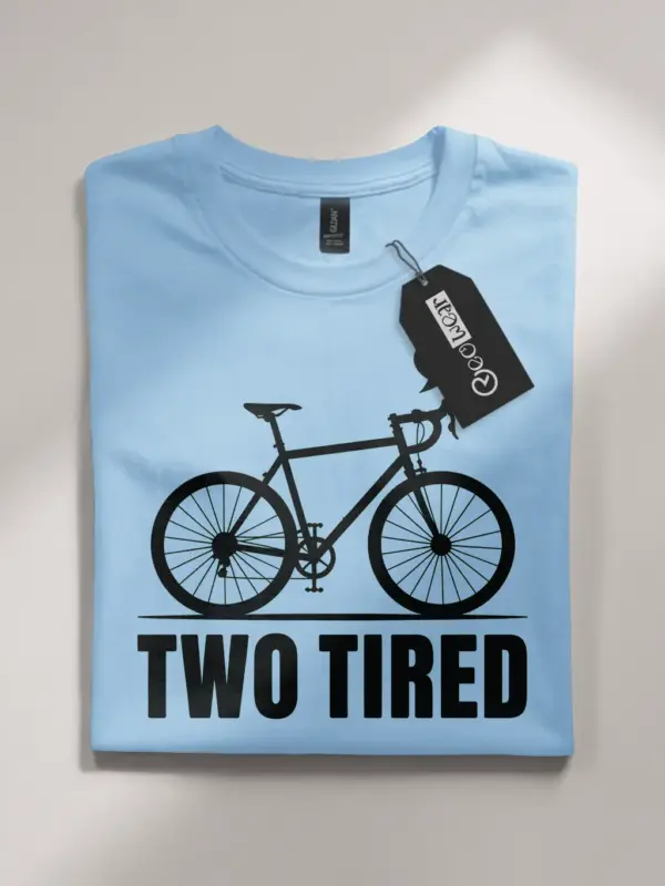 light blue flatlay front view two tired funny cycling pun t-shirt