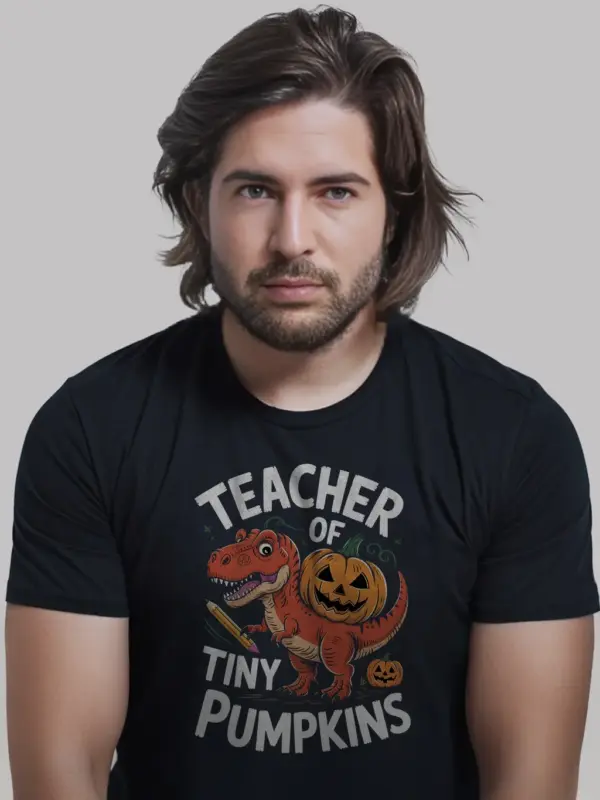 black front view – teacher of tiny pumpkins shirt with dinosaur and pumpkin design