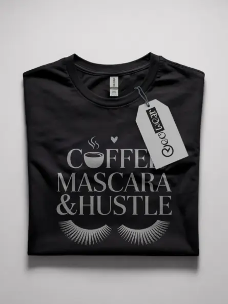 black Front view black coffee mascara hustle t-shirt with lashes and coffee icon