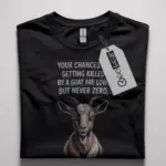 Black shirt front view with “your chances of getting killed by a goat” phrase – funny goat meme t-shirt
