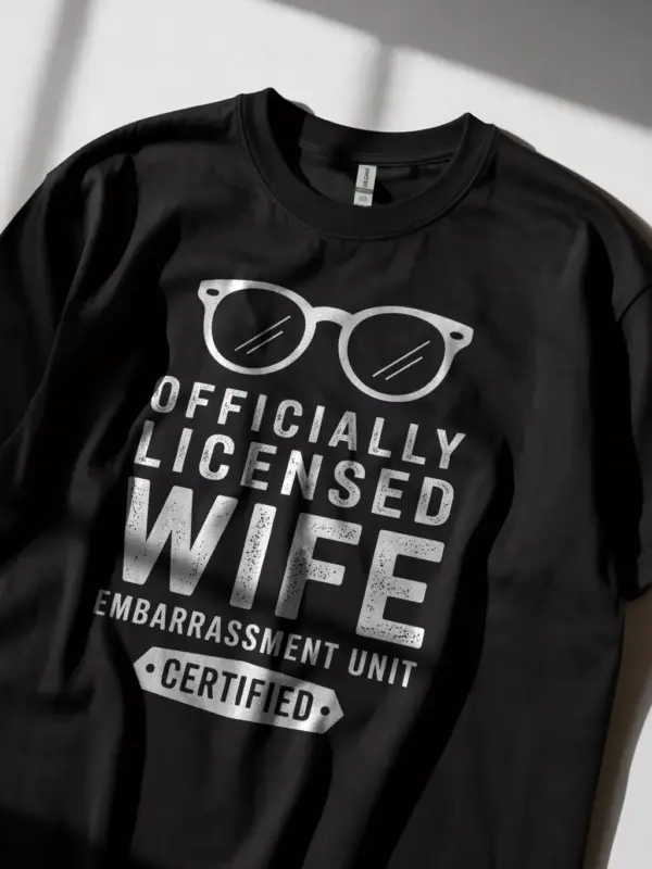Lifestyle shot black shirt officially licensed wife embarrassment unit funny wife embarrassment t-shirt