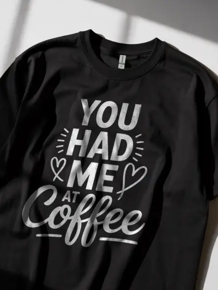Black lifestyle shot – model wearing “You Had Me at Coffee” coffee lover t-shirt