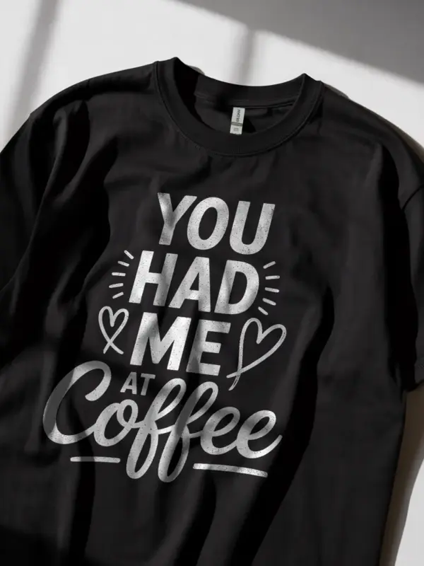 Black lifestyle shot – model wearing “You Had Me at Coffee” coffee lover t-shirt
