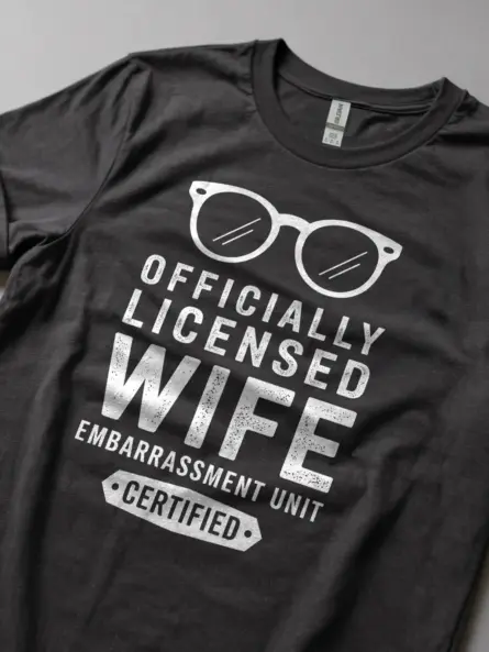 Lifestyle shot dark heather shirt officially licensed wife embarrassment unit funny wife embarrassment t-shirt