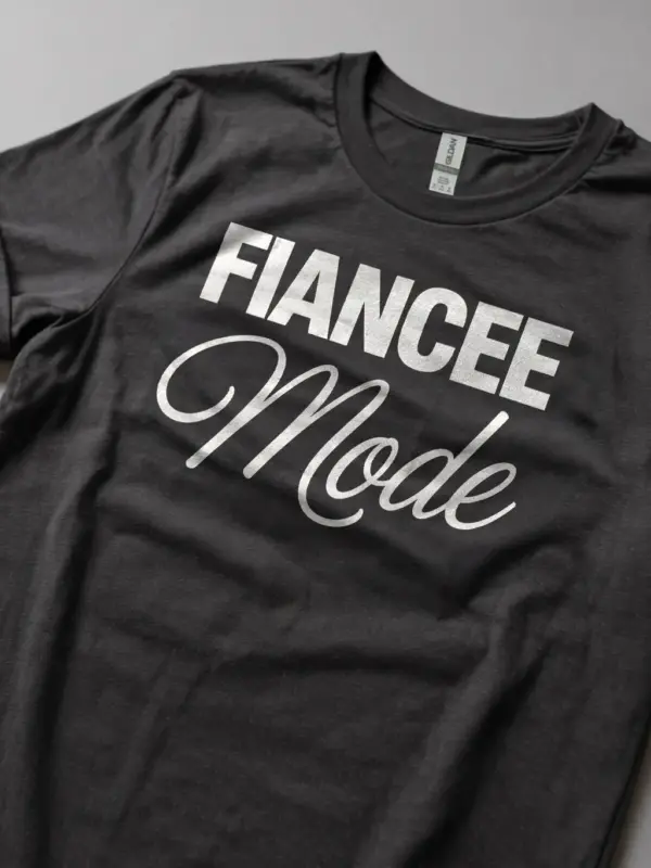 dark heather Lifestyle shot dark heather future bride tee with fiancee mode text