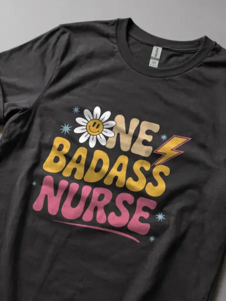 dark-heather-lifestyle-underestimate-me-retro-one-badass-nurse-tee-lifestyle-shot