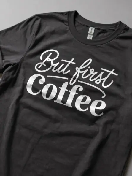 Lifestyle image of dark heather but first coffee shirt for office workers