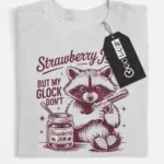 grey flatlay Sweet But Will Throw Hands Shirt front view with raccoon graphic