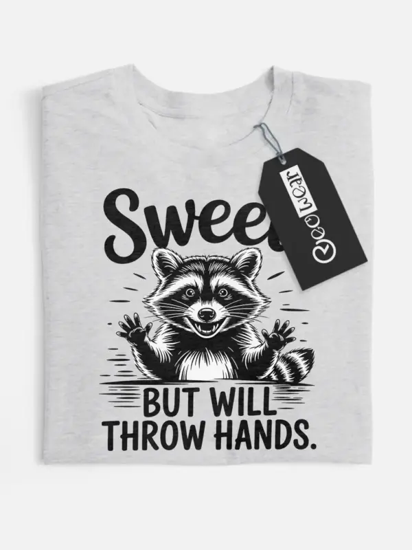 grey flatlay Sweet But Will Throw Hands Shirt front view with raccoon graphic