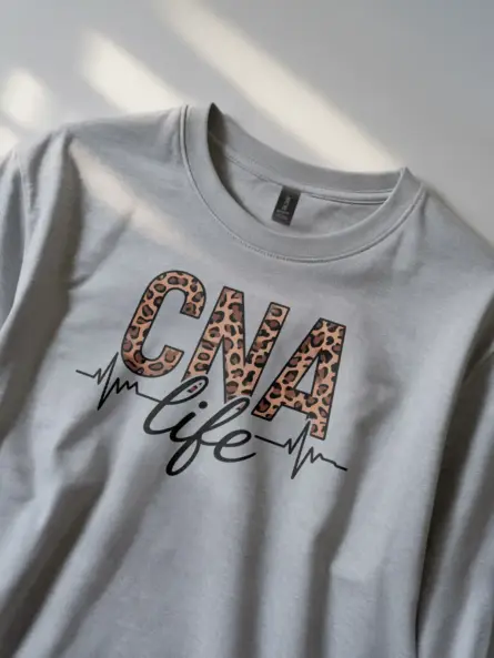 grey cna life leopard print shirt front view with EKG line