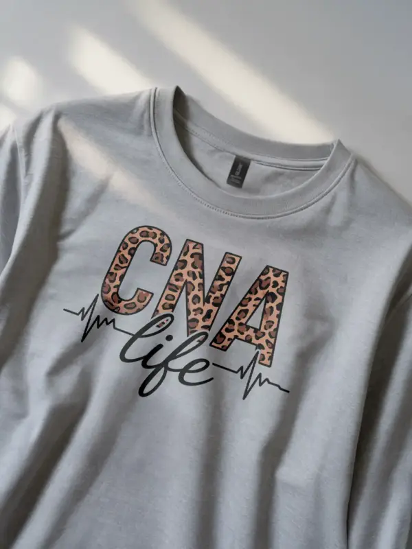 grey cna life leopard print shirt front view with EKG line