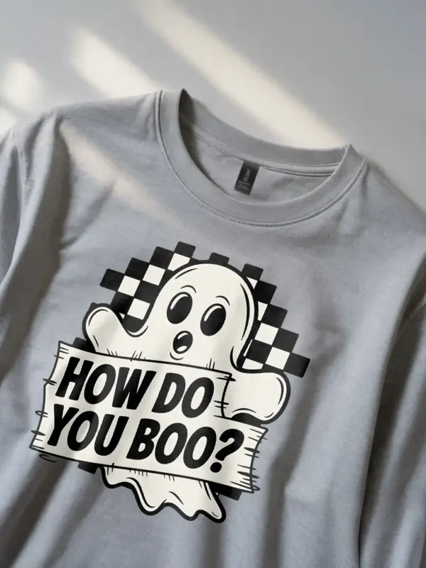 grey lifestyle – person wearing grey cute ghost Halloween t-shirt outdoors