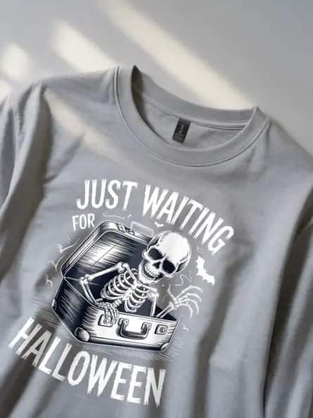 grey front – skeleton emerging from suitcase spooky skeleton waiting for Halloween t-shir
