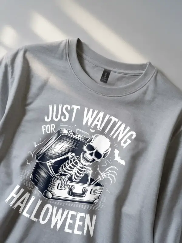 grey front – skeleton emerging from suitcase spooky skeleton waiting for Halloween t-shir
