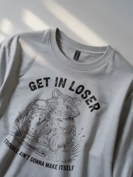 grey Shirt Get In Loser Trouble Ain’t Gonna Make Itself Funny Raccoon Mischief T-Shirt Front View