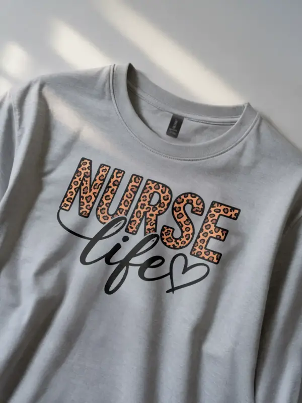 Lifestyle image of grey nurse life shirt with animal print for nurses
