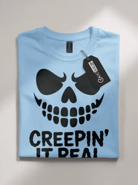 light blue flatlay Front view Creepin It Real Halloween T-Shirt for adults