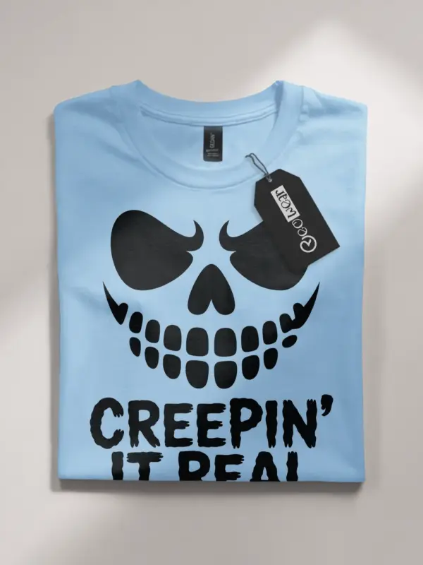 light blue flatlay Front view Creepin It Real Halloween T-Shirt for adults