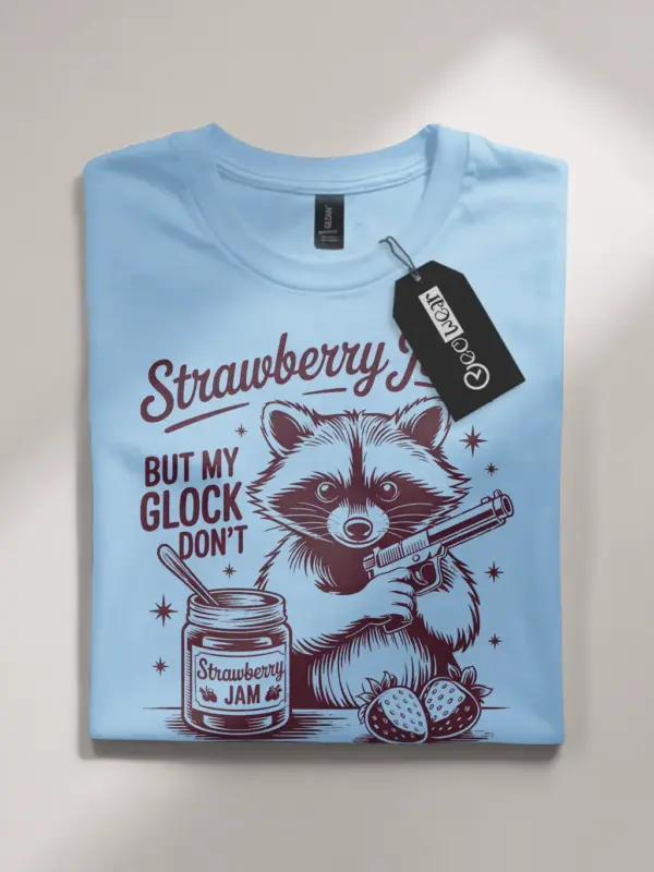 light blue flatlay Sweet But Will Throw Hands Shirt front view playful raccoon