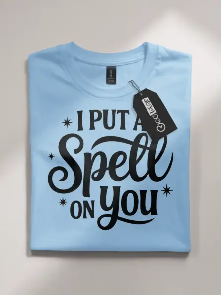 light blue flatlay front view i put a spell on you t-shirt script typography
