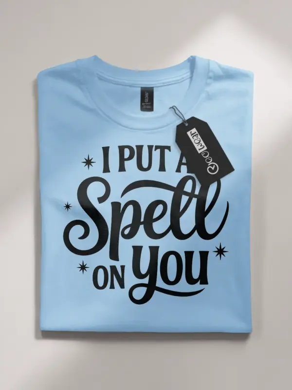 light blue flatlay front view i put a spell on you t-shirt script typography