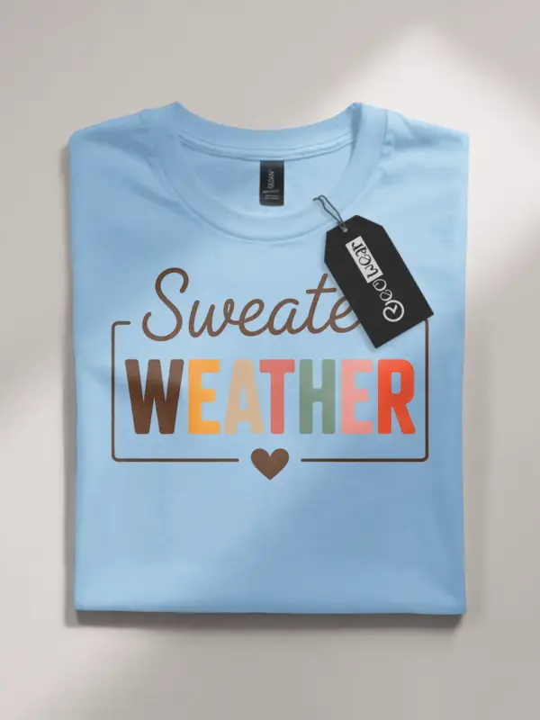 light blue flatlay front view – warm fall quote tee – cozy sweater weather shirt