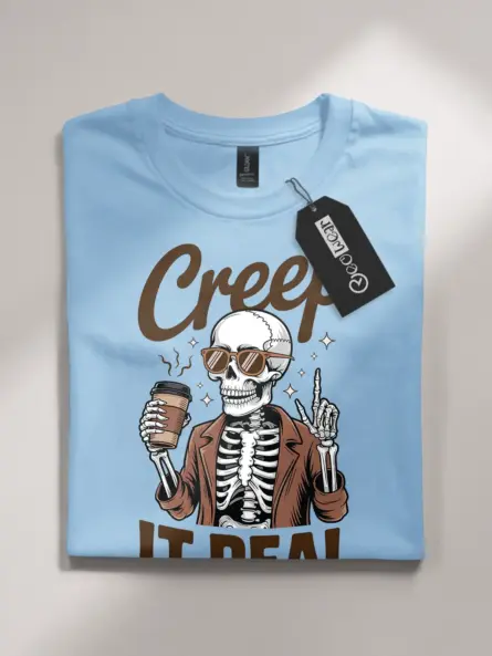 light blue flatlay front – Creep It Real retro funny skeleton coffee shirt