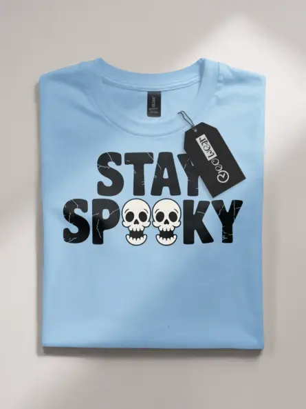 Light Blue front view – stay spooky t-shirt with block font and skulls in light blue