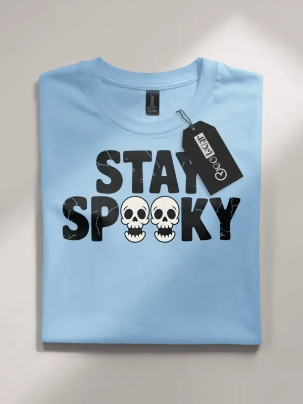 Light Blue front view – stay spooky t-shirt with block font and skulls in light blue