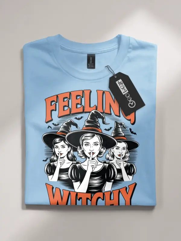 front – vintage witchcore Halloween shirt with Feeling Witchy text light blue flatlay