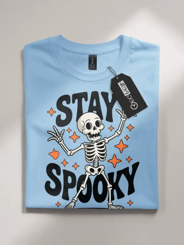 light blue flatlay front – vintage Stay Spooky dancing skeleton Halloween t-shirt