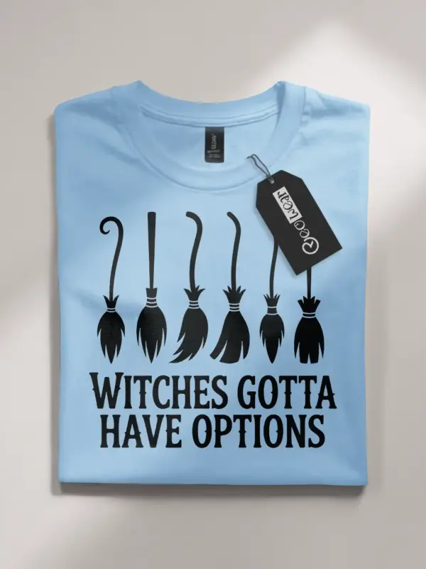 Lifestyle image of light blue flatlay shirt with witches gotta have options quote