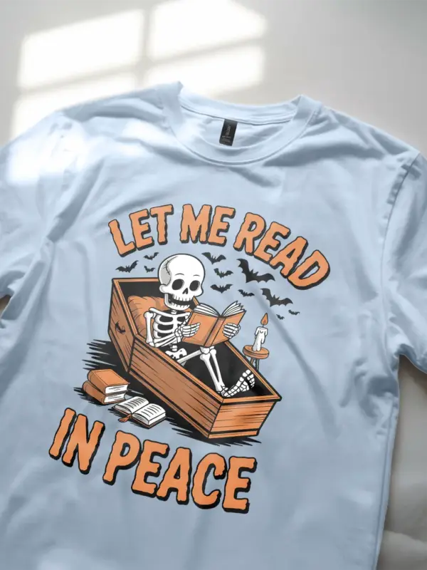 light blue lifestyle – cozy horror lit apparel – skeleton reading t-shirt