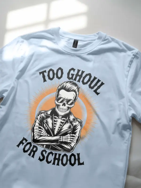 close-up – orange sunburst detail on light blue funny skeleton biker t-shirt