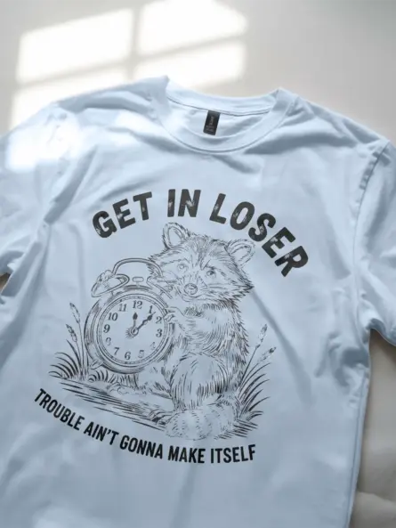 light blue Shirt Get In Loser Trouble Ain’t Gonna Make Itself Funny Raccoon Mischief T-Shirt Front View