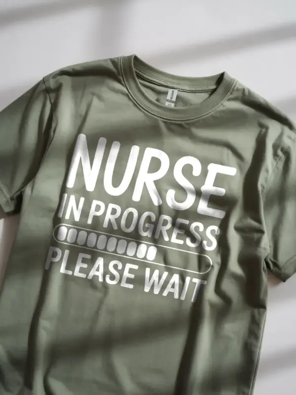 Lifestyle image of military green nurse in progress t-shirt on nursing school student