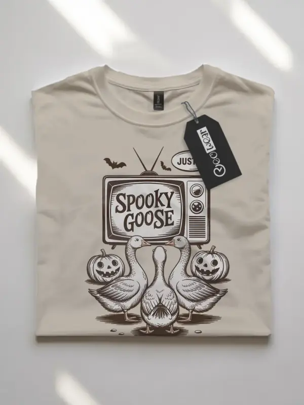 natural flatlay front – spooky goose Halloween t-shirt with TV and pumpkin design