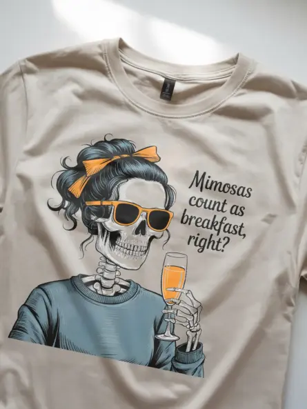 natural relaxed woman wearing navy mimosa brunch skeleton t-shirt at cafe