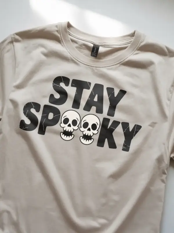 Natural angled view – Halloween skull design minimalist tee in natural color