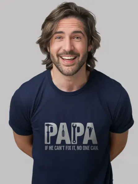 Papa in navy fix-it shirt in garage workshop