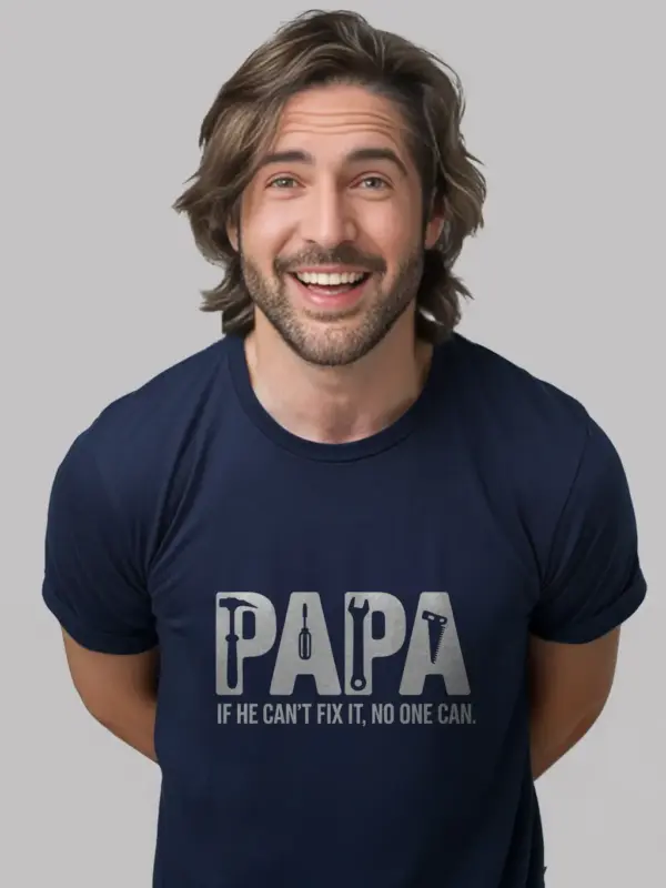 Papa in navy fix-it shirt in garage workshop