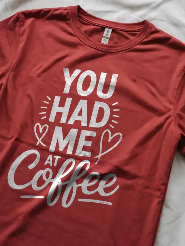 Red lifestyle shot – woman wearing coffee lover t-shirt in cozy setting