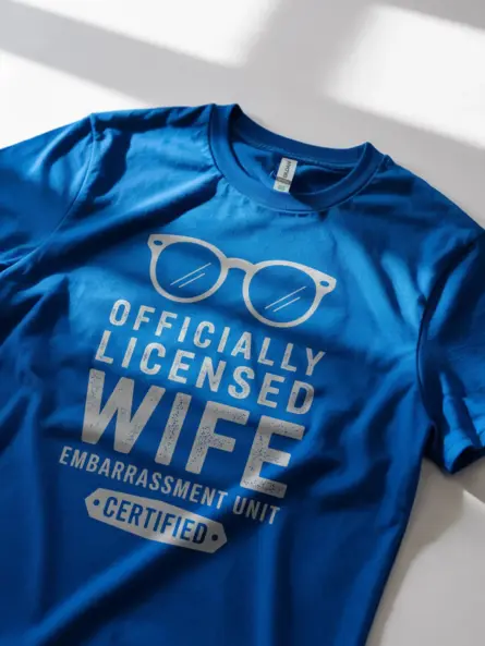 Lifestyle shot royal blue shirt officially licensed wife embarrassment unit funny wife embarrassment t-shirt