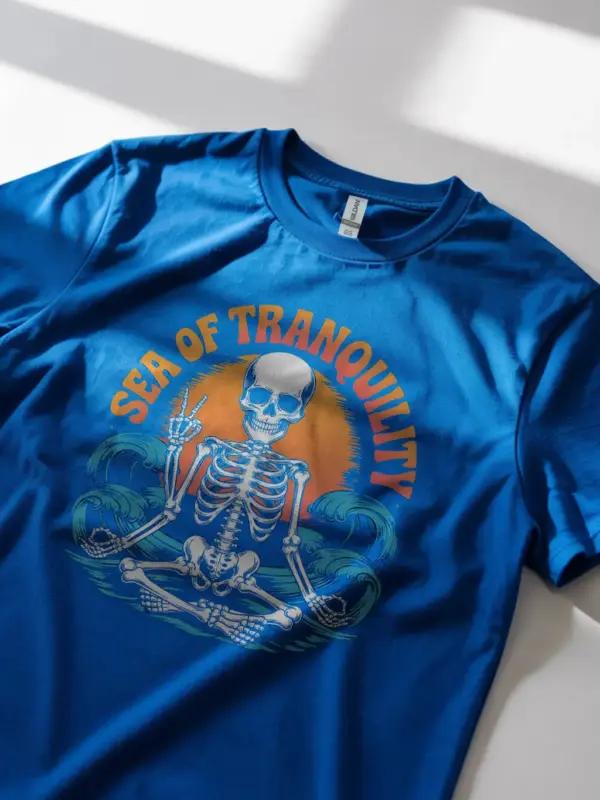 Royal Blue sea of tranquility t-shirt lifestyle – beach style skeleton peace shirt