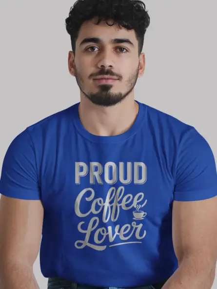 Barista in royal blue proud coffee lover tee making latte