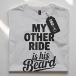 white flatlay front view my other ride is his beard shirt bold women’s tee
