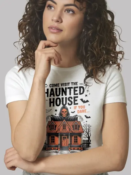 White Halloween fan wearing white haunted house t-shirt