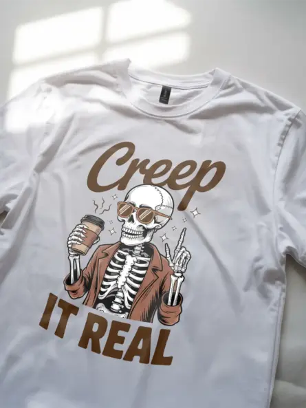 close-up – retro text detail on white funny skeleton coffee shirt